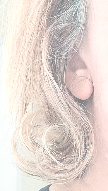 Christine Bush, self portrait of lock of hair with ear.